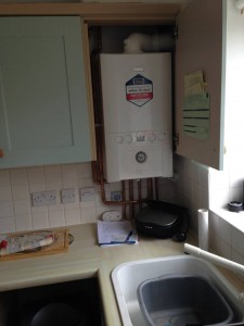 Replacement of heat only boiler and boiler mate thermal store with combi in kitchen  